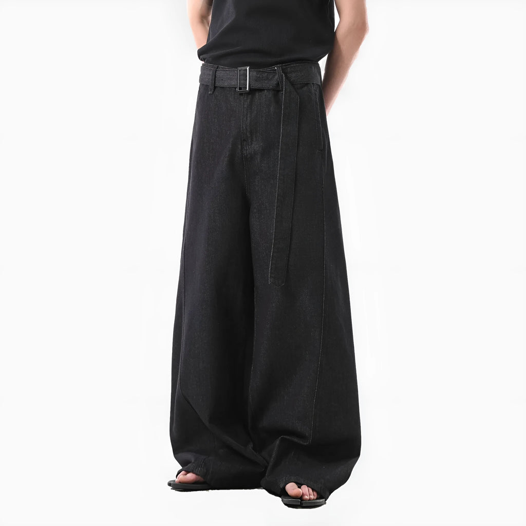 Black high-waist straight-leg denim jeans with a zip fly on a plain background.