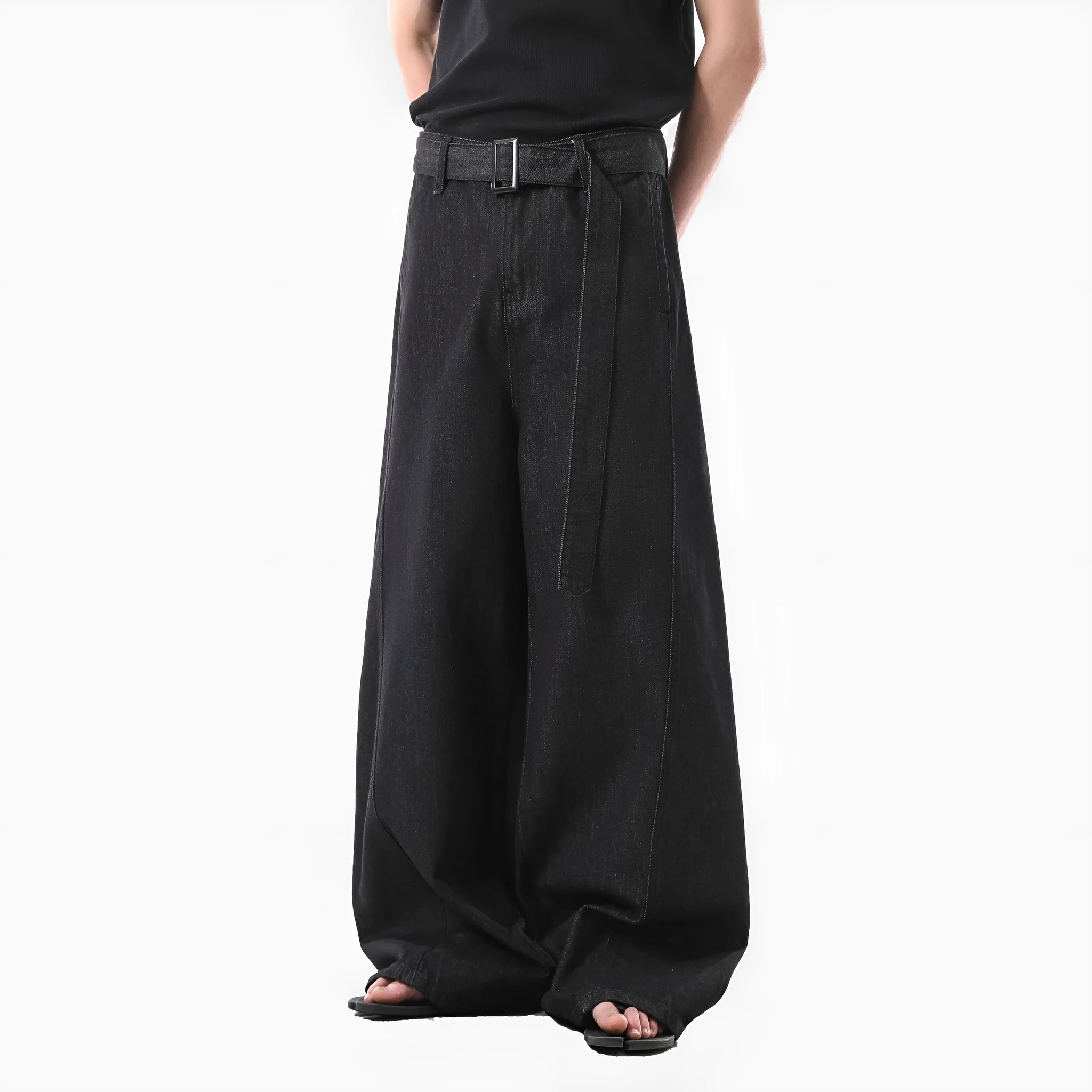 Black high-waist straight-leg denim jeans with a zip fly on a plain background.