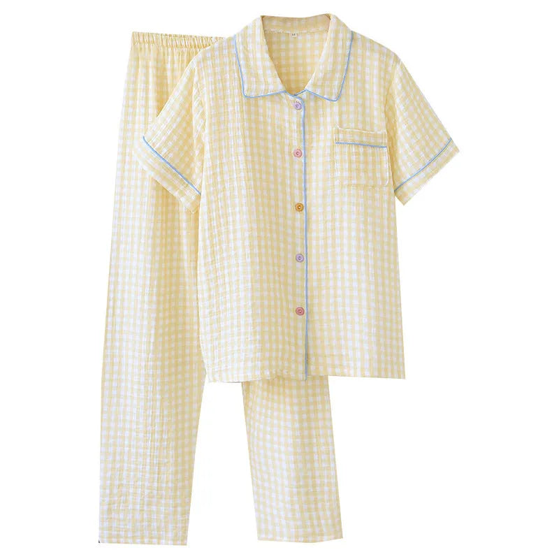 Washed cotton short-sleeved top and trousers set in a floral or plaid pattern, laid flat.
