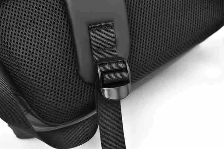 Large waterproof backpack in black with sewing thread detailing and included computer bag
