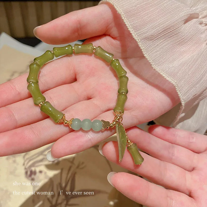 Handmade Chinese style glass women's bracelet featuring bamboo joint design elements.