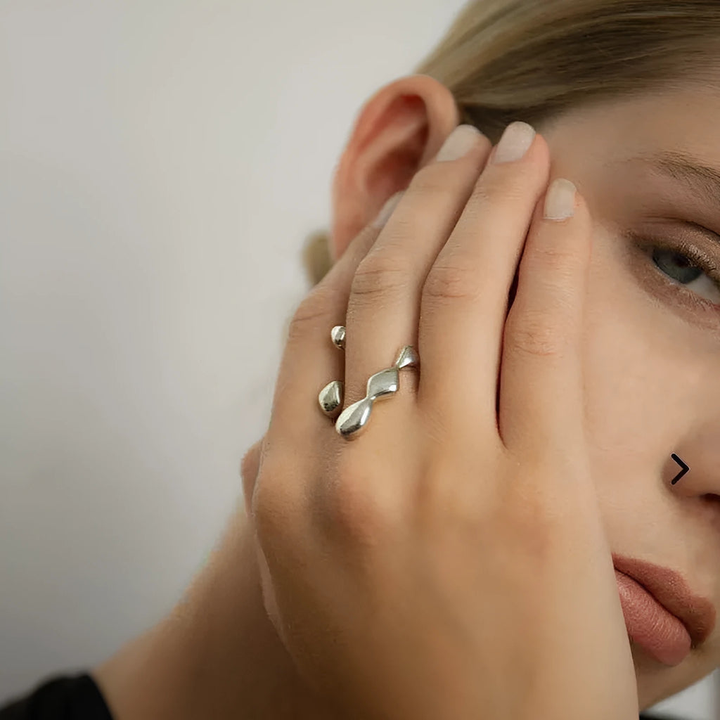 Adjustable opening brass fashion ring with circular sphere decoration in gold or silver finish