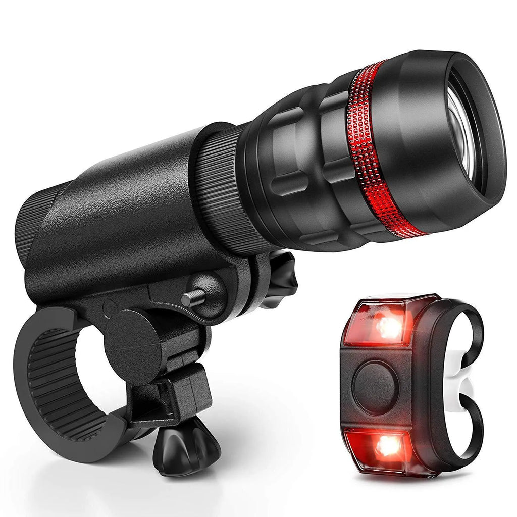 Bicycle headlight and red taillight set with metal handlebar mounting bracket on a white background.