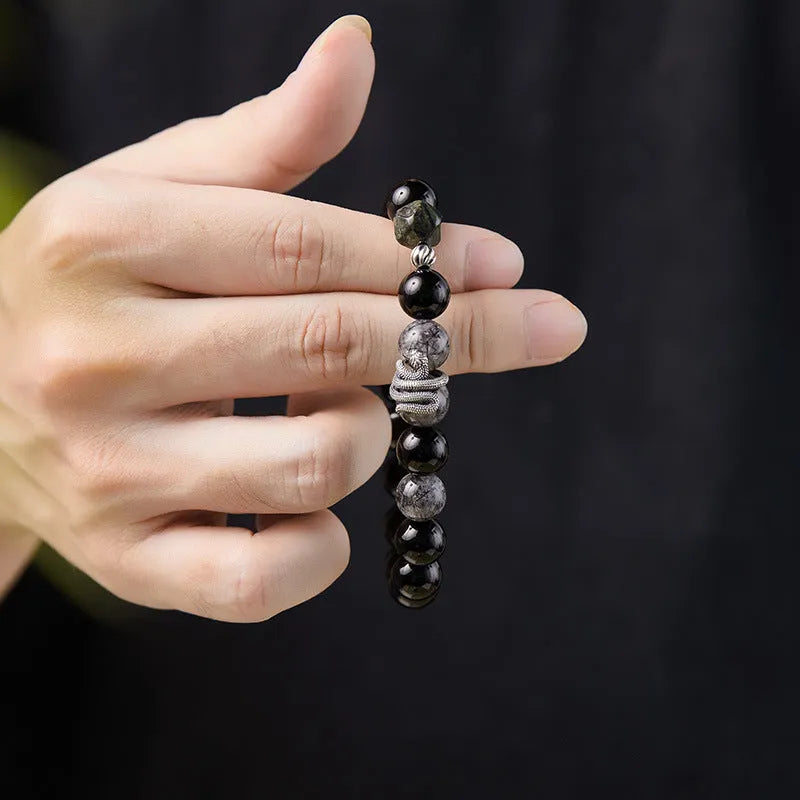 Men's S925 sterling silver bracelet with obsidian black snake motif measuring 10mm wide