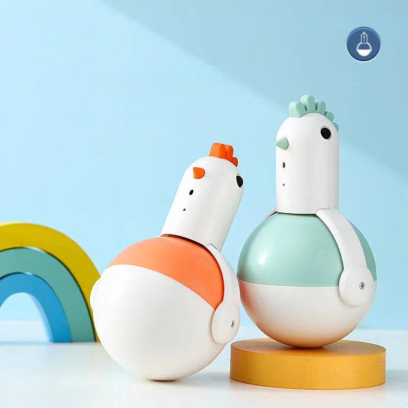 Green or orange electric cat toy chicken with laser and sound features on a flat surface.