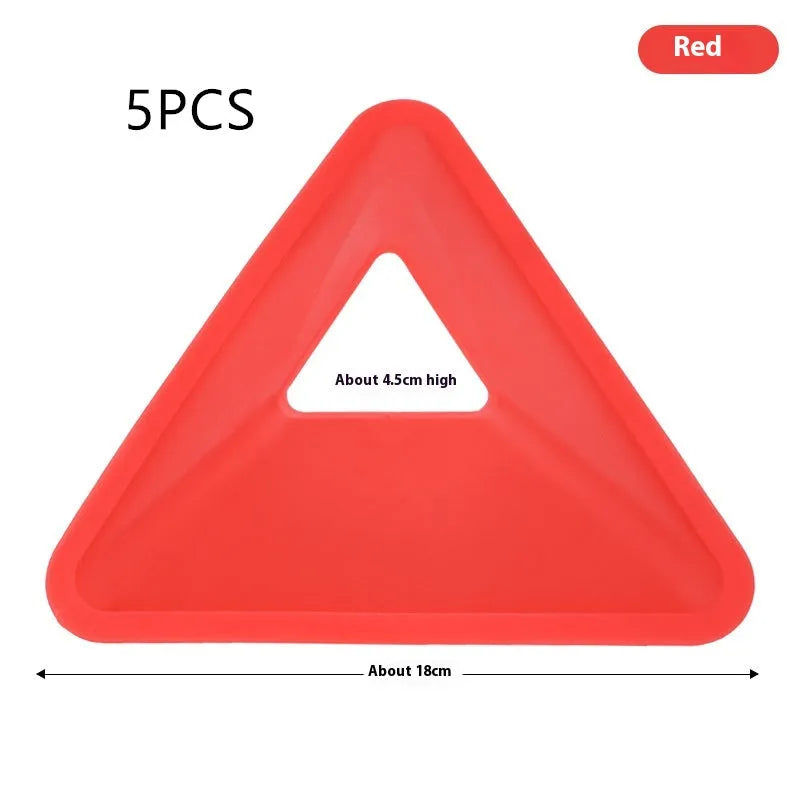 Set of triangle sign plates in various colours for football training obstacle courses on grass