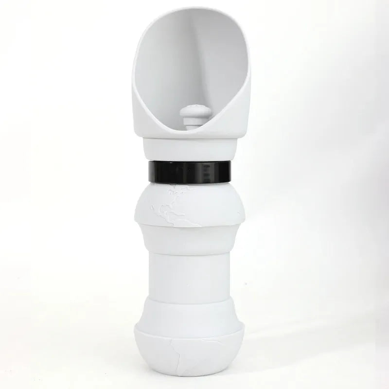 Silicone folding dog water cup shown in mint green colour, unfolded and flat.