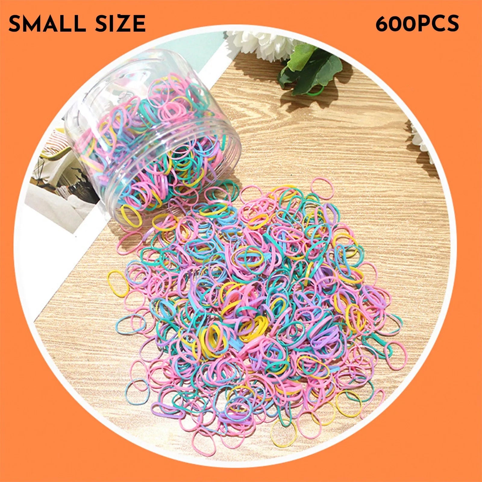 Multi-colour TPU baby hair ties in a reusable plastic storage container.
