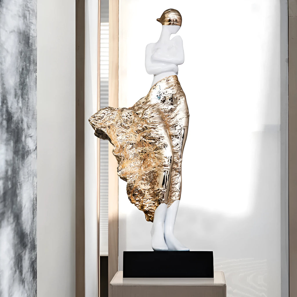 A tall, modern sculptured character ornament in a rose gold metallic finish, standing 48cm high.