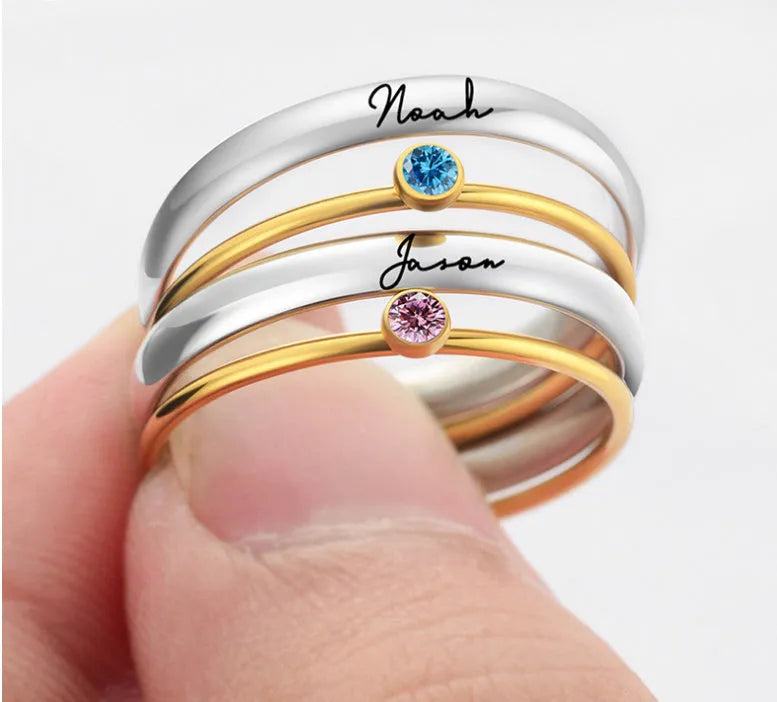 Geometrical titanium steel ring for women with December birthstone colour and superimposed engraving pattern.