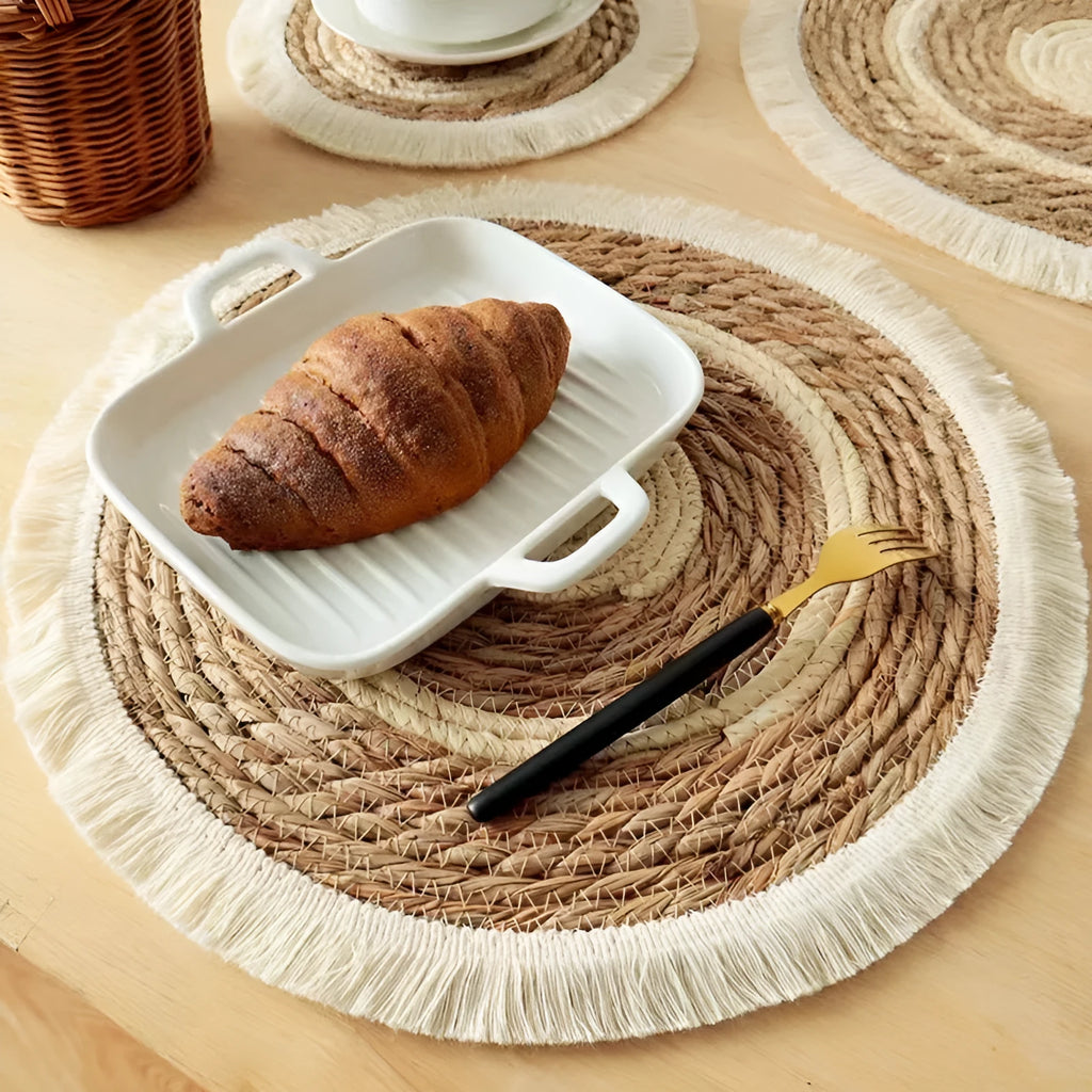Round Japanese straw placemat with tassel detailing in papyrus material, available in four diameter sizes