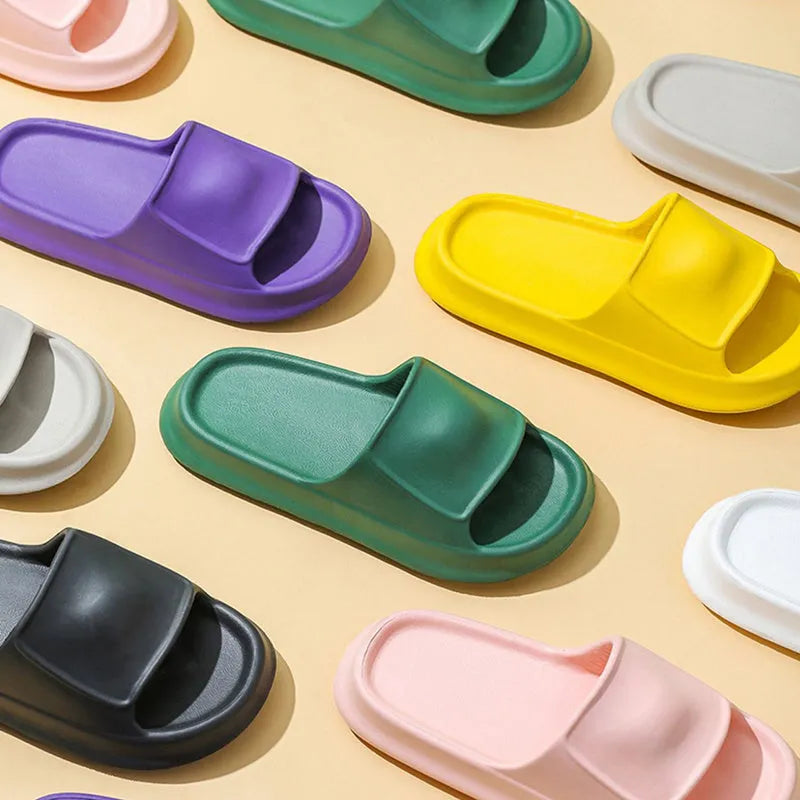 Thick-soled EVA flip-flop slippers in multiple colours on a white background.