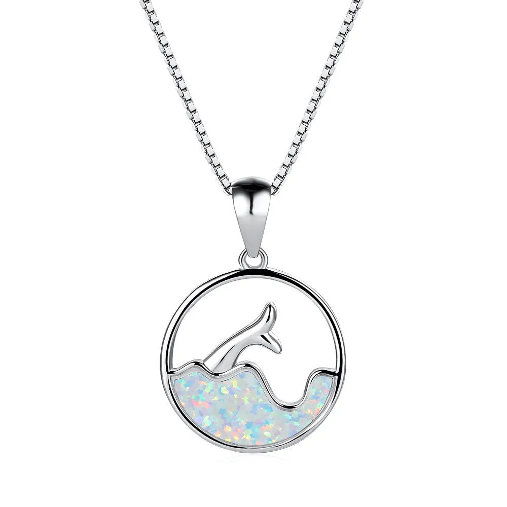Geometric fishtail pendant necklace with electroplated white gold finish and round decorative elements