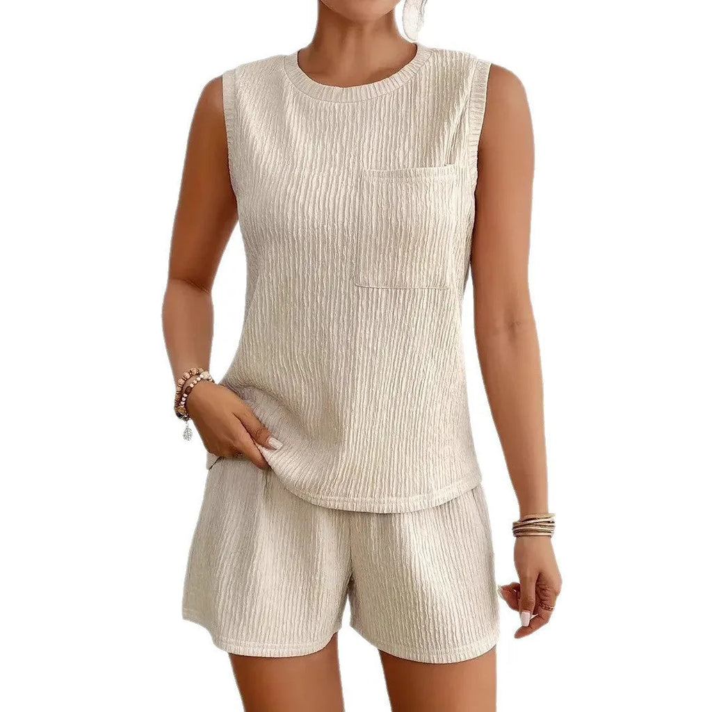 Women's apricot sleeveless vest and matching shorts set laid flat, solid colour polyester fabric.