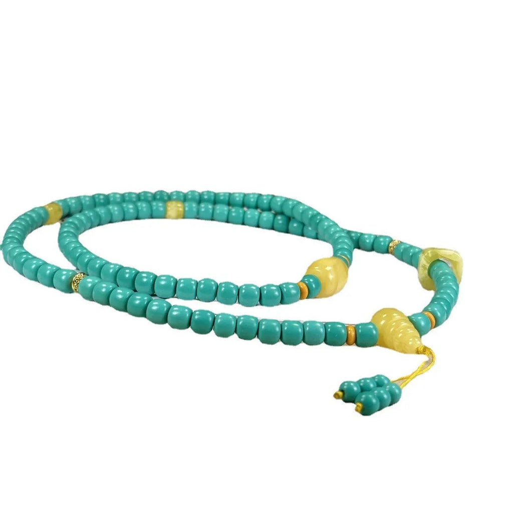 Turquoise mesh flower lucky pendant on an adjustable ball bead necklace, 71-80cm long.