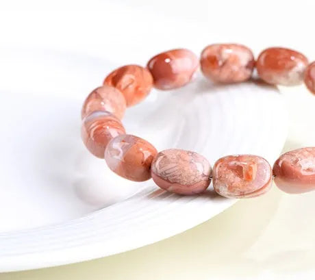 Natural cherry agate barrel bead bracelet with geometric beads and Ruyi charm