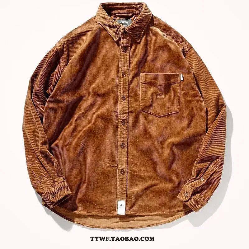 Caramel loose fit corduroy long sleeve shirt with cardigan style on a hanger.