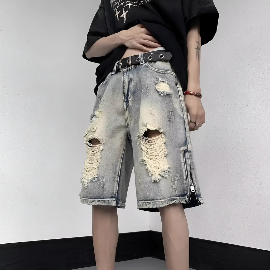 Blue retro denim shorts with a wide-leg loose fit and tattered detailing on a mannequin.
