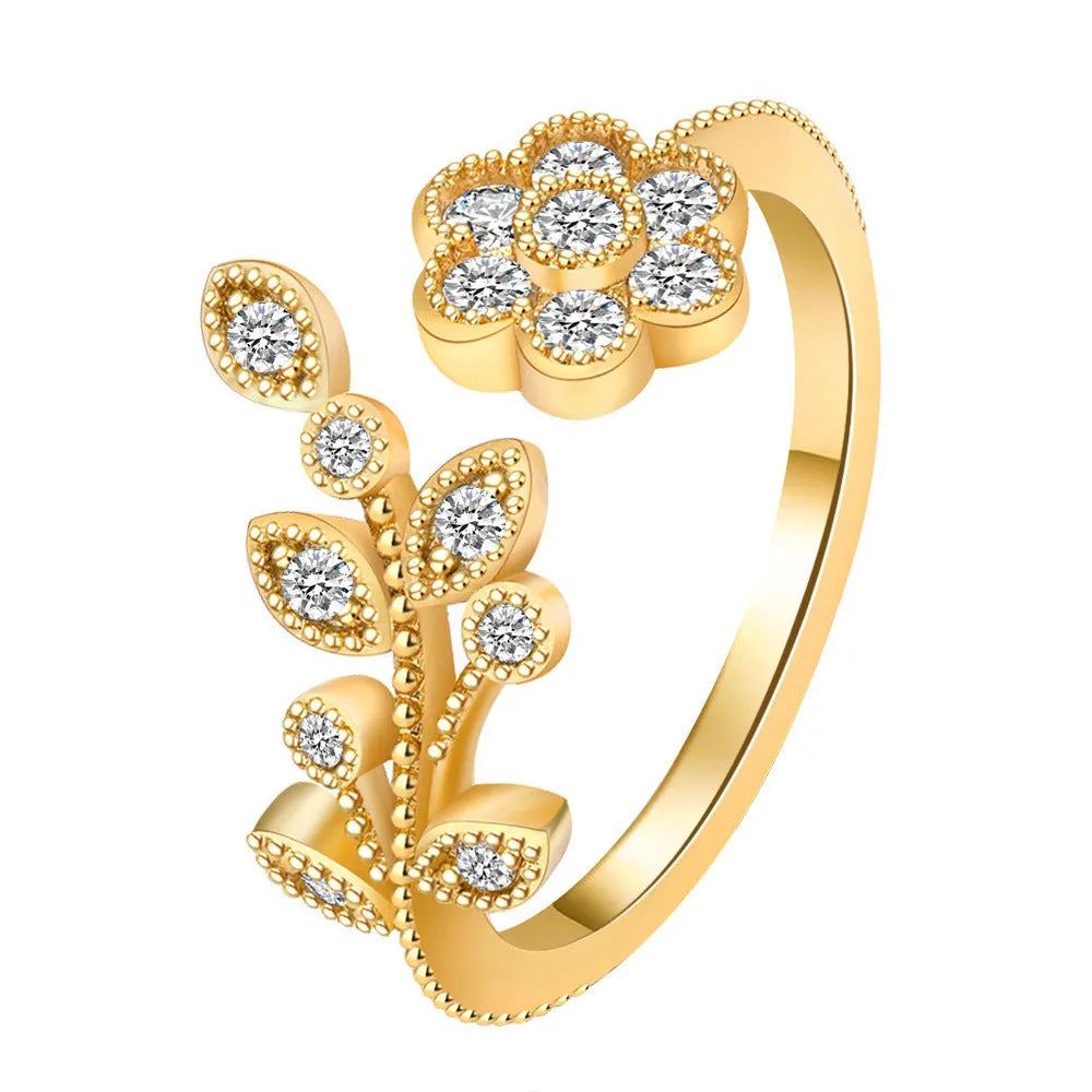 Women's open ring with diamond-cut floral leaf design in gold finish
