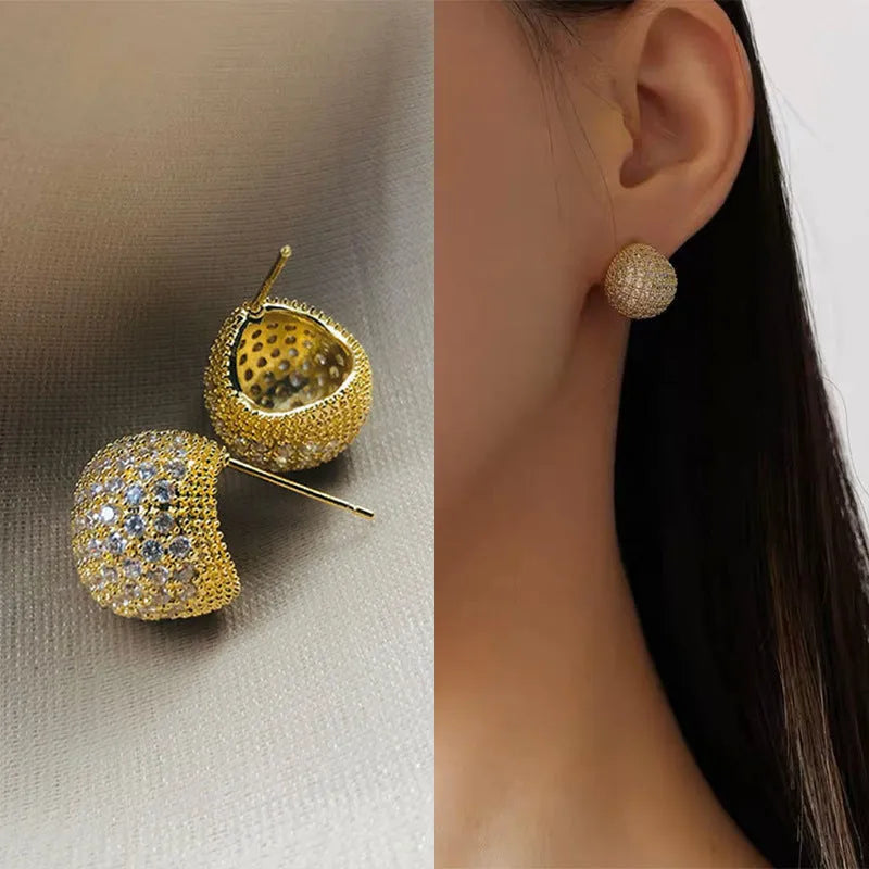Geometric drop-shaped women's earrings with full diamond detailing and golden bean elements