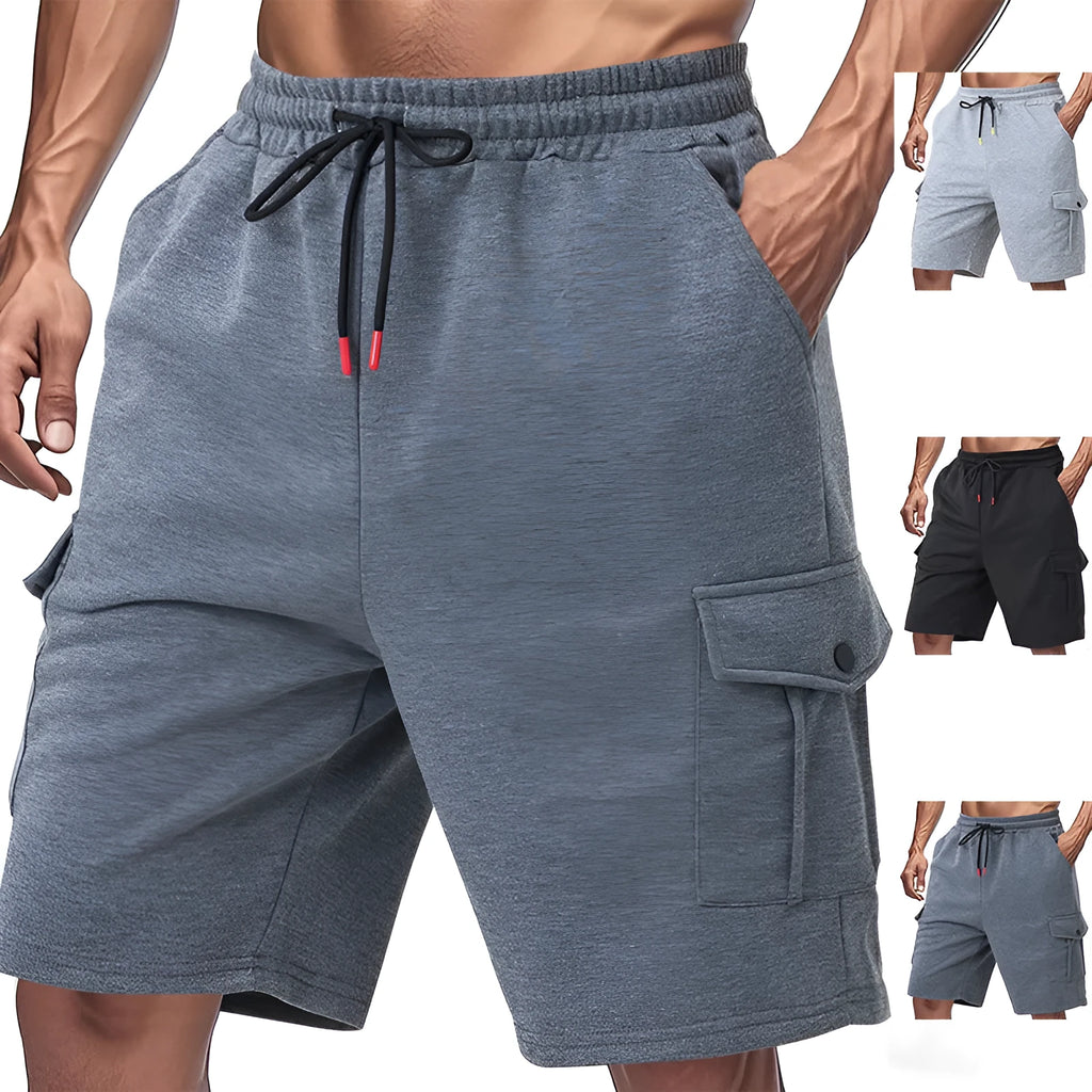 Man wearing heavy grey loose-fit cargo sports shorts with multiple pockets, made from terry towel fabric.