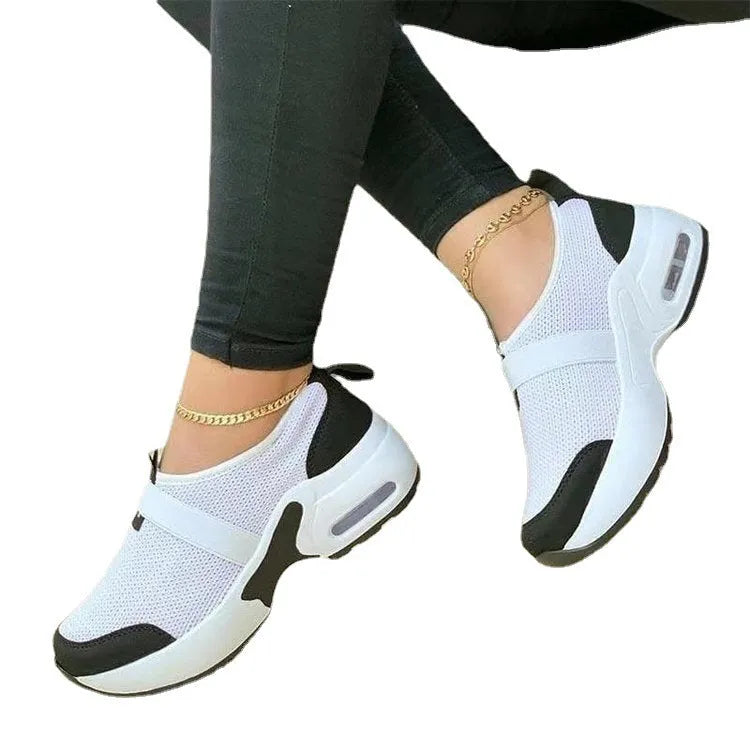 Women's flat mesh sneakers in multiple colours with a round toe and rubber sole.