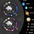 Pair of natural stone beaded bracelets with zodiac sign symbols on a background.
