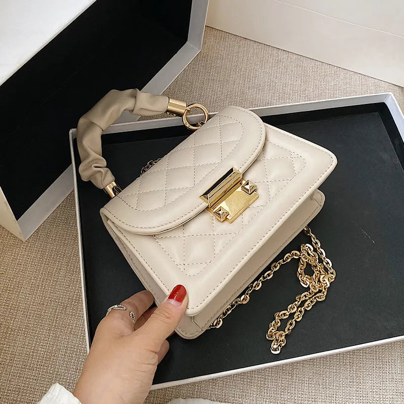 Korean style small square shoulder bag in purple with crossbody strap and structured design