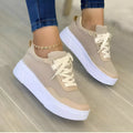 Women's casual lace-up flat sneakers in green with mesh upper and thick rubber sole
