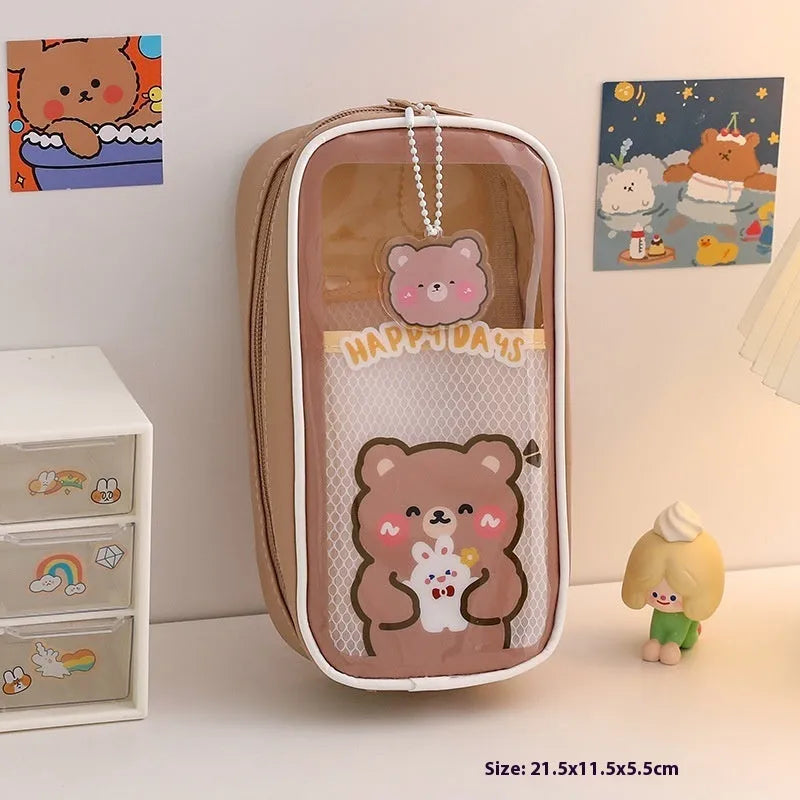 Transparent PVC pencil case with cartoon design showing large capacity interior and zipper closure