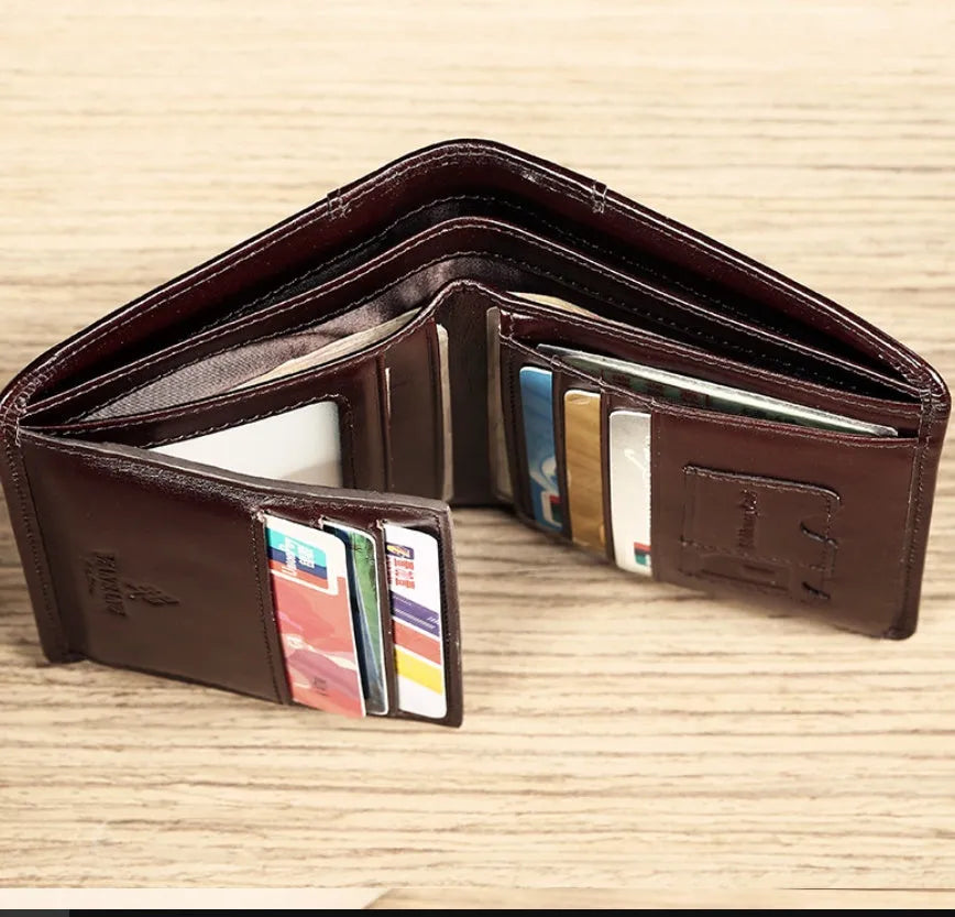 Men's leather wallet open showing photo window, card slots, coin pocket, and banknote compartment.
