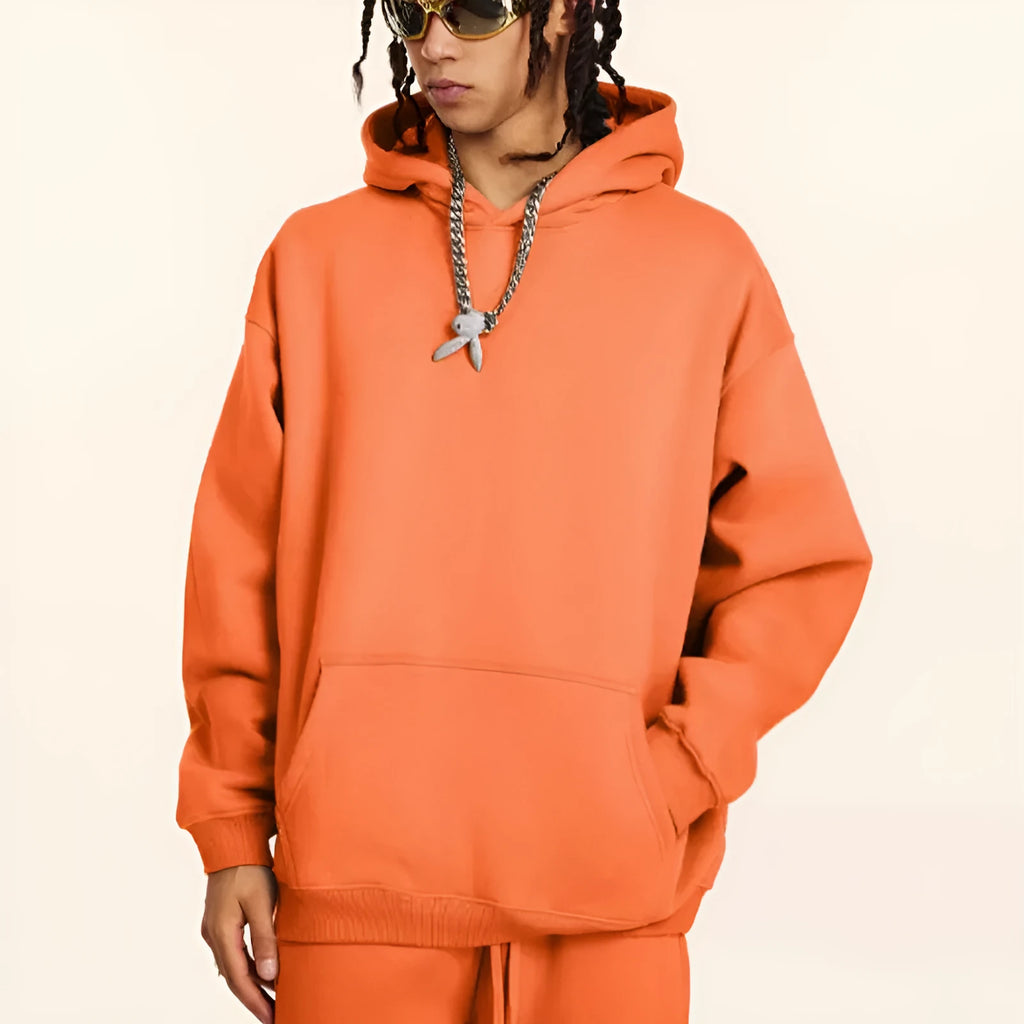 Men's loose fit cotton hooded pullover sweater in grey, showing drop shoulder sleeves.