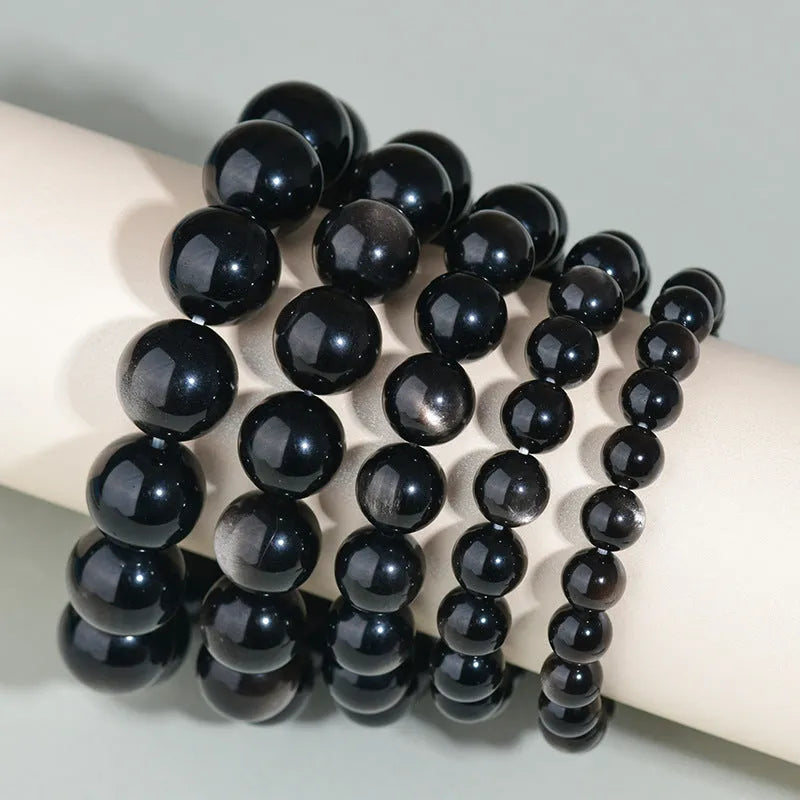 Hand-woven obsidian crystal bracelet with round beads in ethnic style unisex design