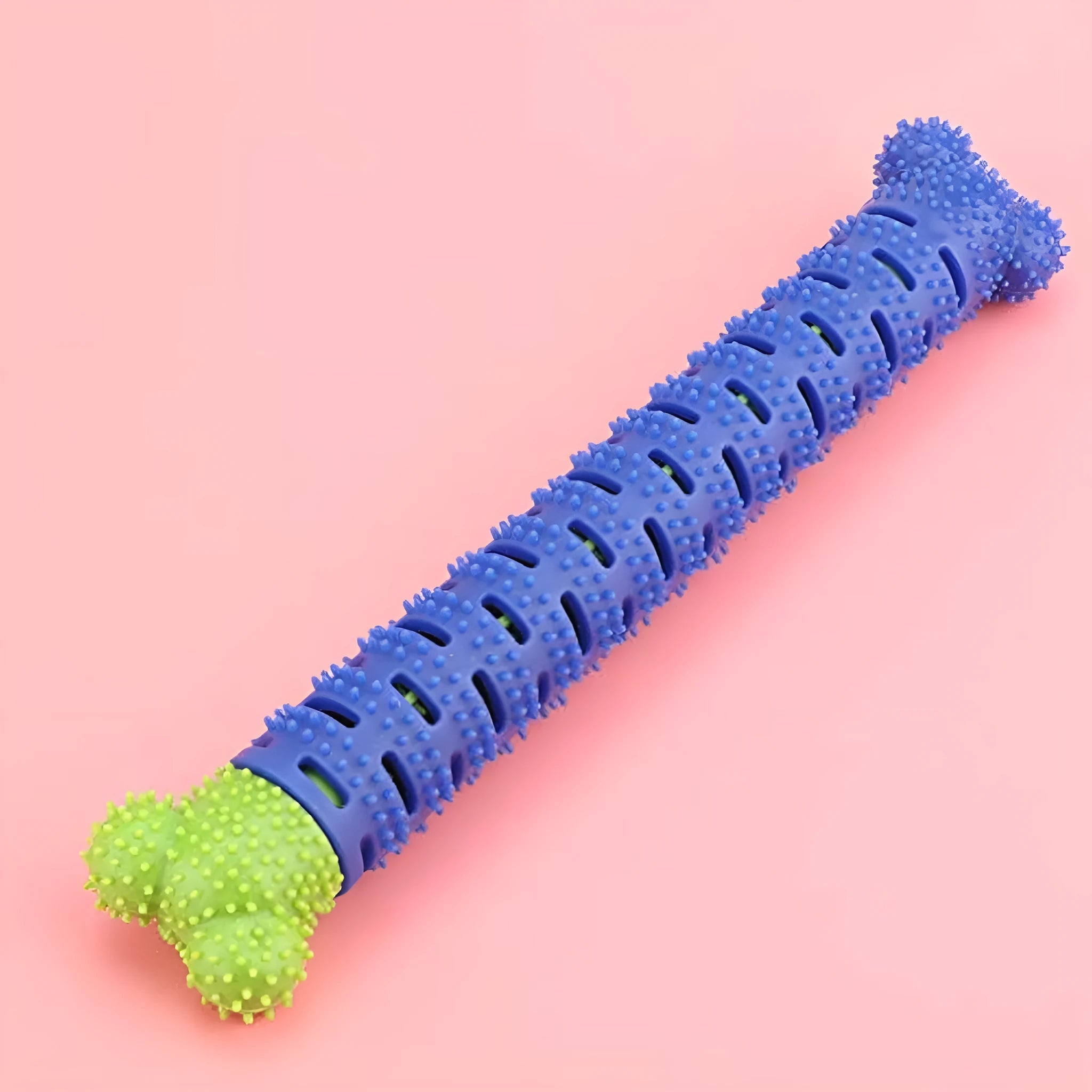 Blue silicone dog dental chew toy with serrated brush head and crevice for toothpaste insertion