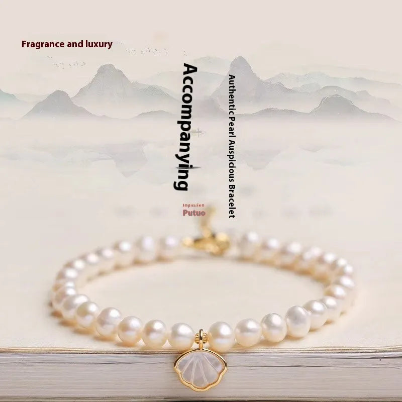 Women's freshwater pearl fan-shaped bracelet with elastic string or extension chain option, 16cm length.