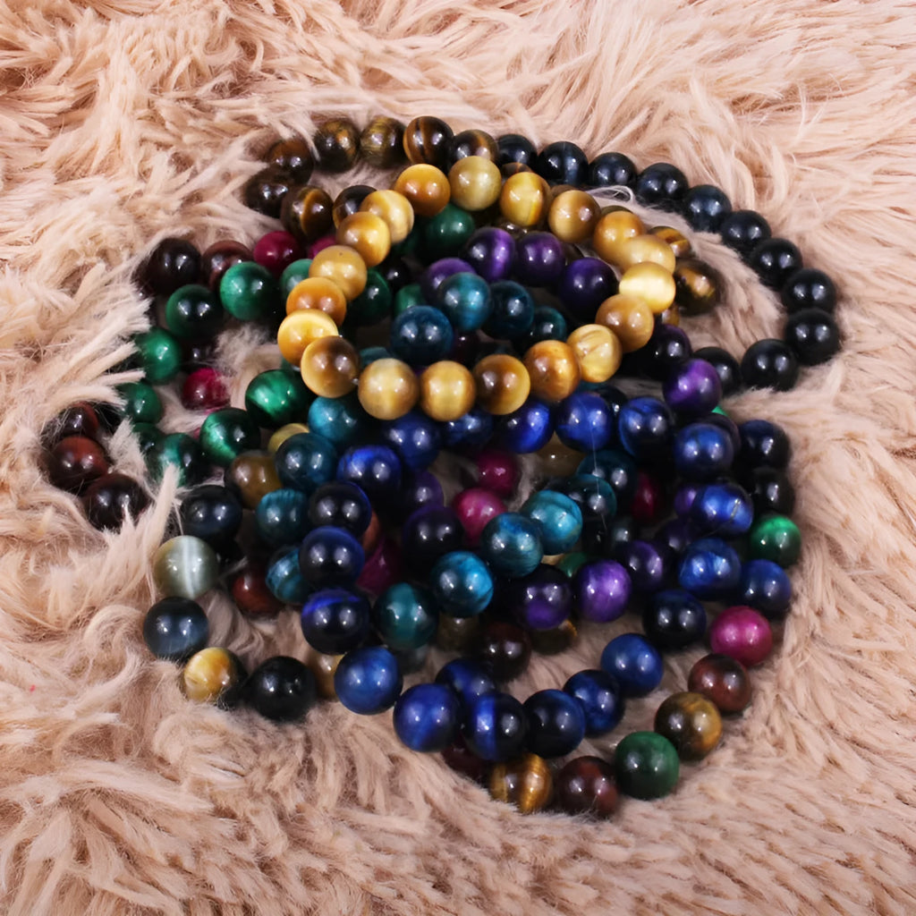 Tigereye crystal bead bracelet showing geometric round beads on a wrist.