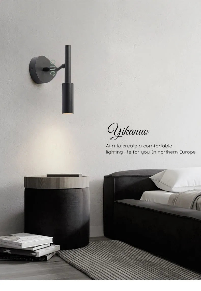 Modern wrought iron wall lamp in black with three colour light options for bedroom or living room