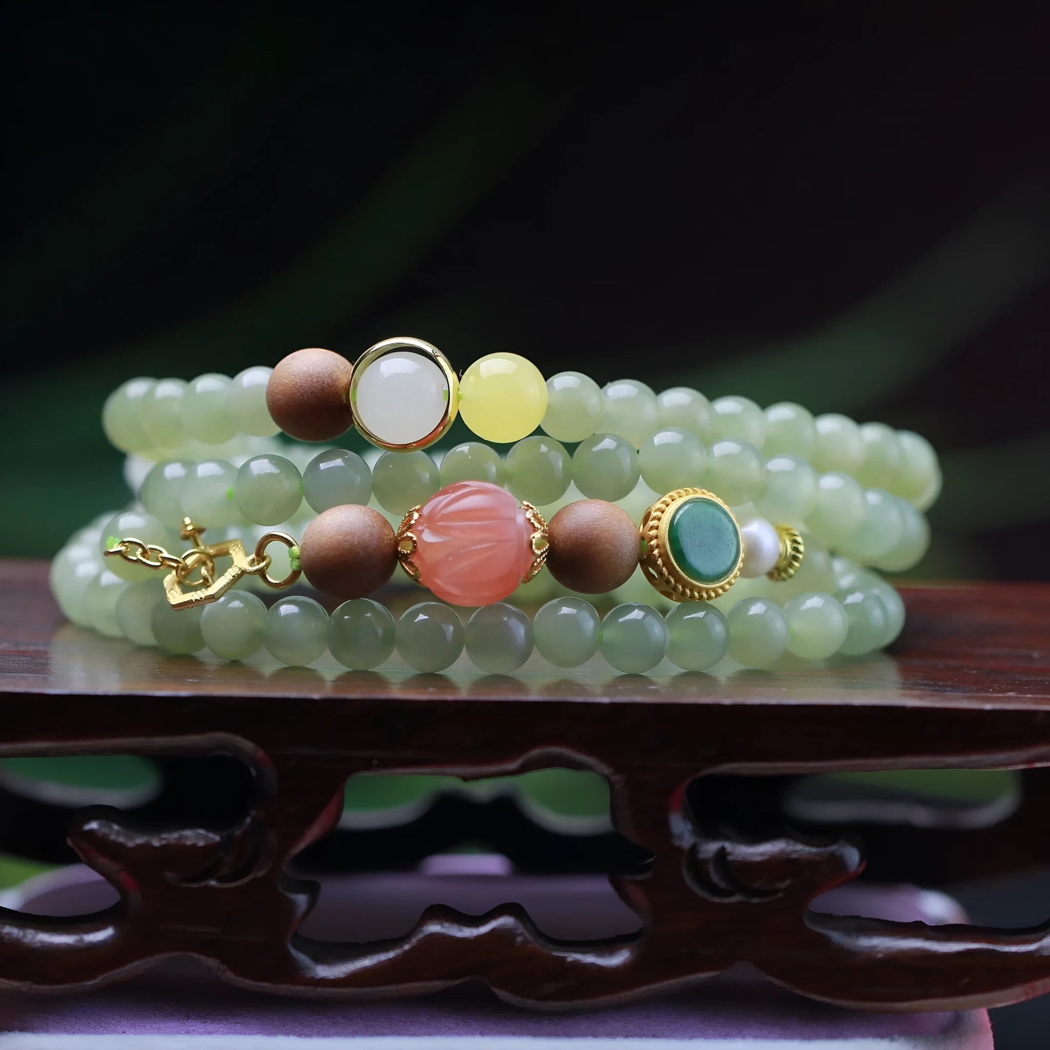Natural Hetian jade necklace with red lotus beads, white sandalwood, and beeswax accents; unisex design with fu character motif