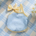 Small dog wearing elastic suspenders vest with heart relief bow in Bondi Blue colour