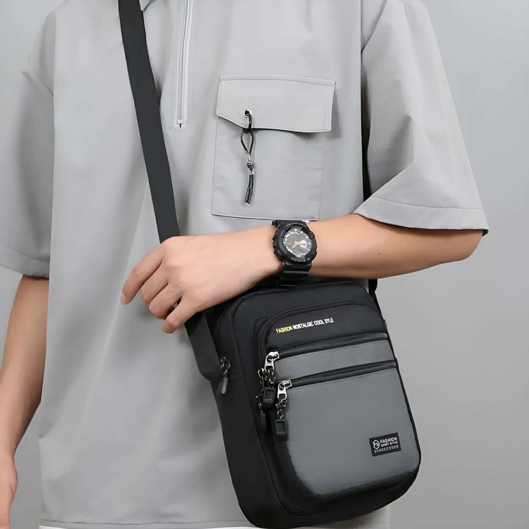 Men's nylon crossbody bag in solid colour with visible stitching, shown in green.