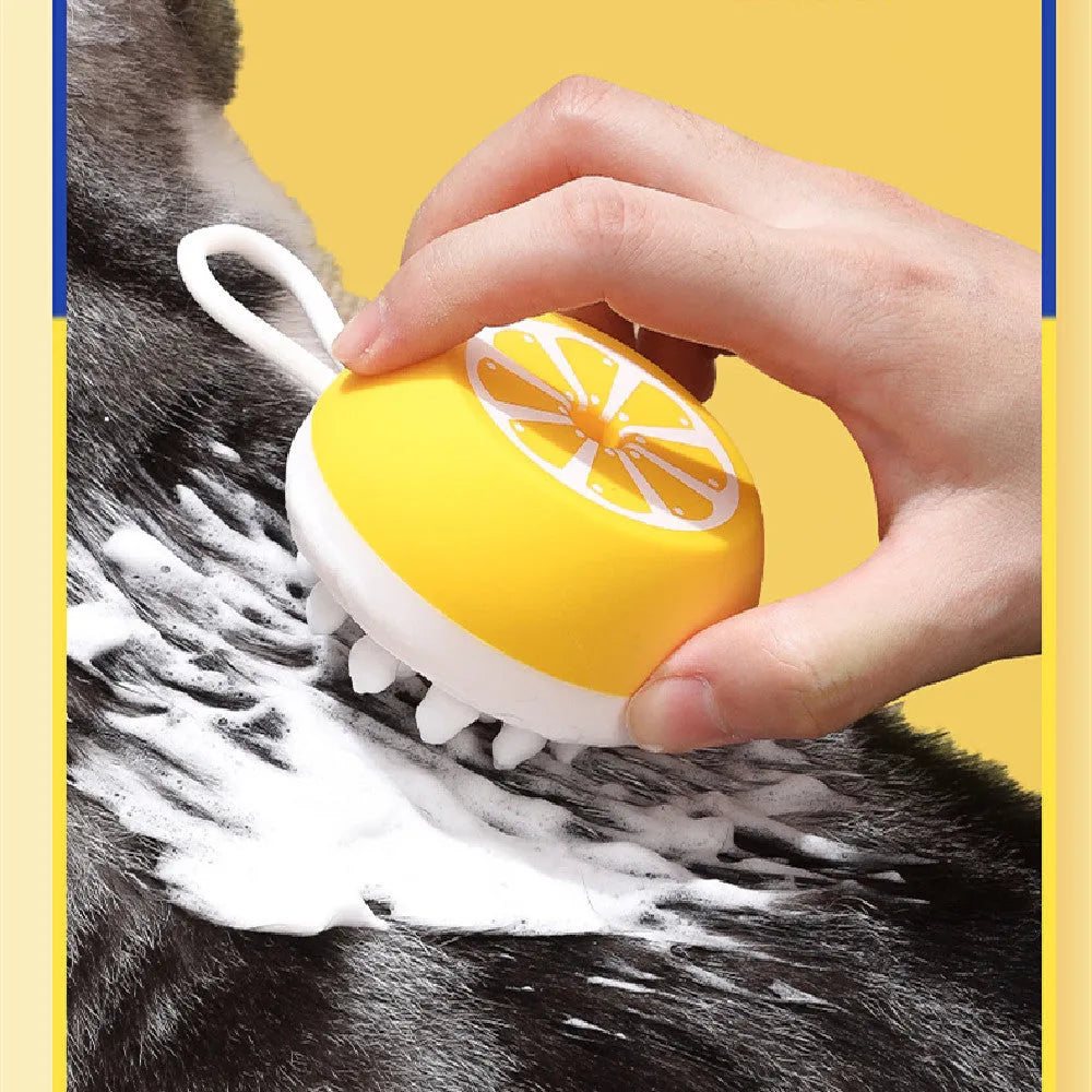 Yellow silicone pet bath brush with massage head and comb teeth for dog cat grooming during washing