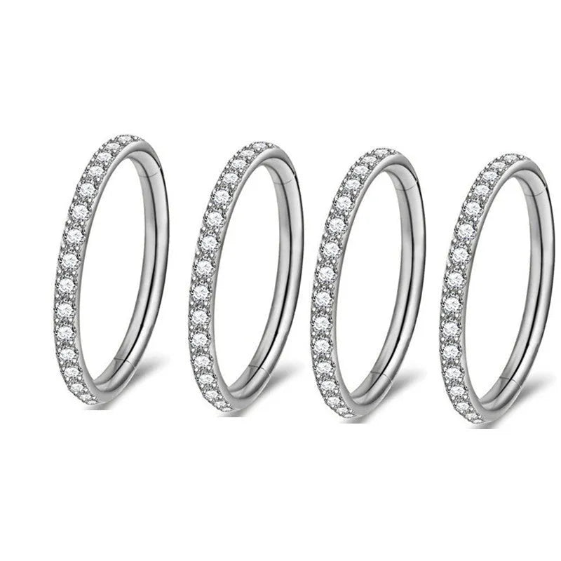 Stainless steel seamless nose ring with diamond accent in gold finish showing circular barbell design