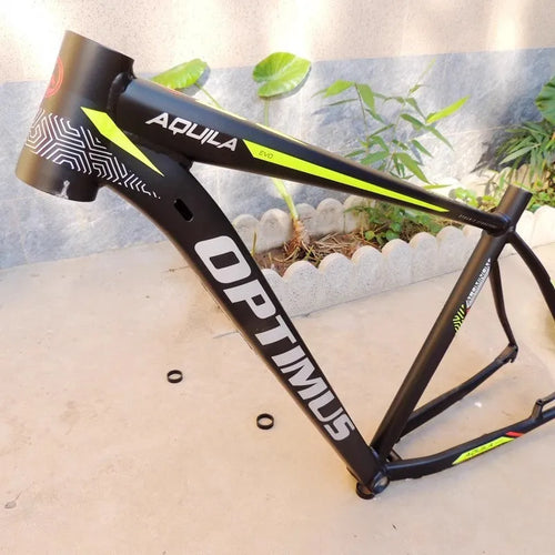 Black green aluminium 29-inch mountain bike frame showing innerline routing and disc brake mounts