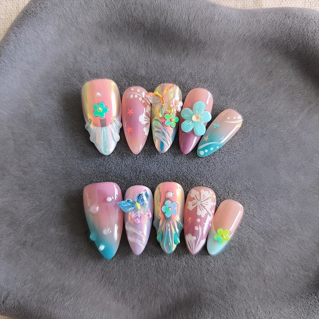 Handmade colourful false nails with embossed small flower and butterfly designs in almond shape.