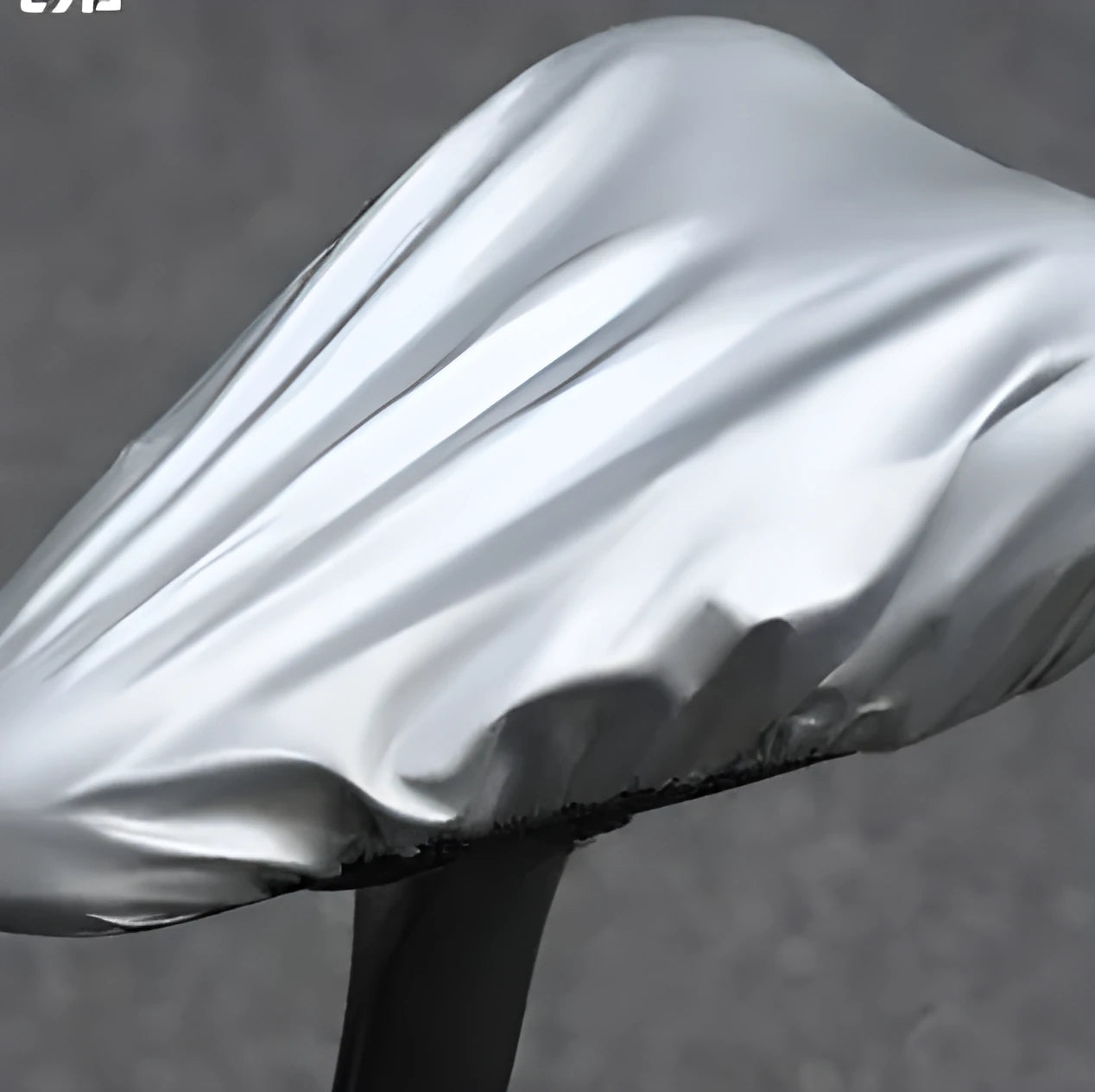 Silver outdoor cycling bike saddle rain cover made from 100% polyester on a bicycle