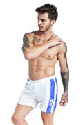 Men's blue lace-up sports shorts with padding, shown in a slim-fit style for running.