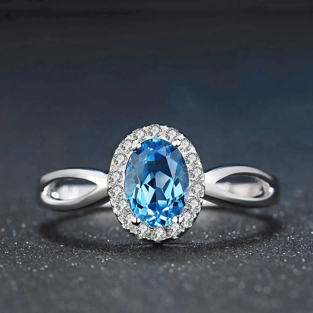 925 sterling silver blue topaz jewellery set with geometric design including earrings, ring, pendant and necklace