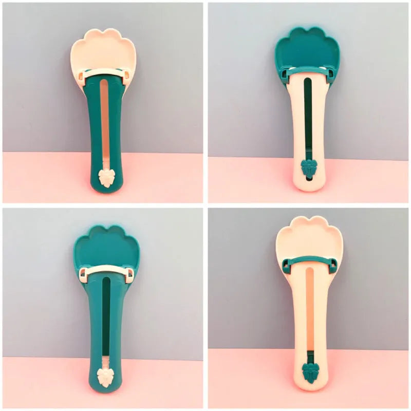 Green and pink plastic pet feed spoon with squeezer dispenser for liquid food and treats