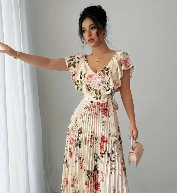 Apricot V-neck dress with digital floral print, ruffled short sleeves, and oversized pleated swing skirt.