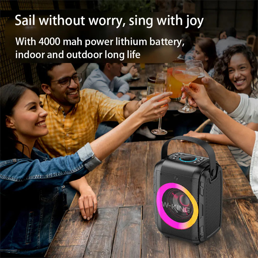 Black Bluetooth speaker with cool light circle in horizontal position on table